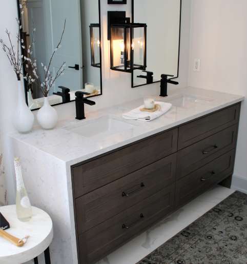 Sleek double sink vanity with marble counters from a professional cabinet manufacturer.