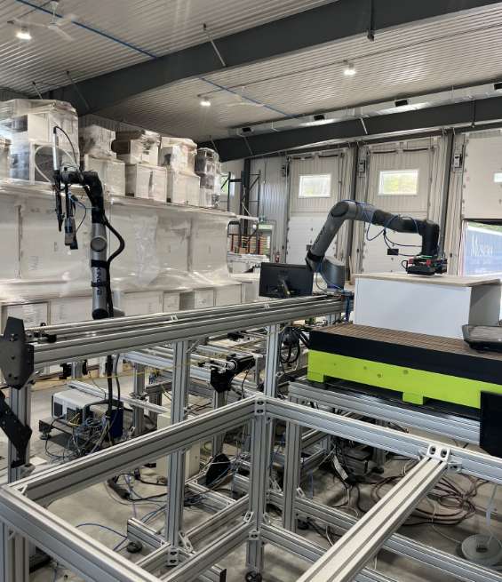 Industrial manufacturing equipment inside a high-volume wholesale kitchen cabinet supplier warehouse.
