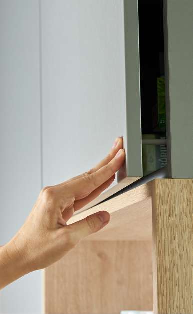 Close-up of modern cabinetry crafted by an Ottawa kitchen cabinet manufacture with a wood grain shelf.