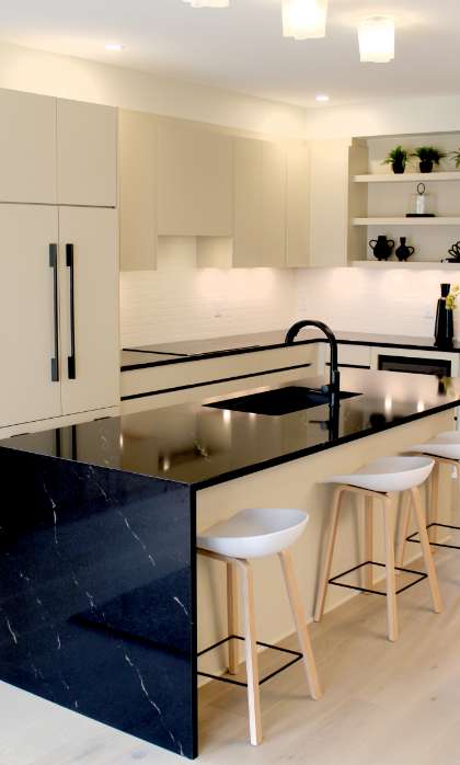 Sleek contemporary kitchen featuring custom units from a professional cabinet manufacturer.