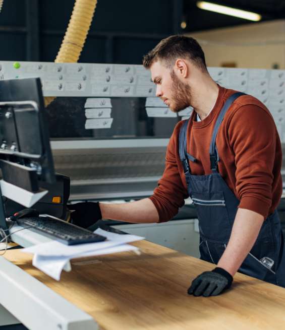 Professional working in a facility, exploring cabinet manufacturing jobs in Ottawa at Koka.