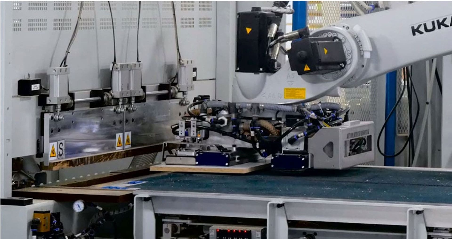 Automated robotic lean cell for panel processing highlighted in recent cabinet manufacturing news in Ontario.